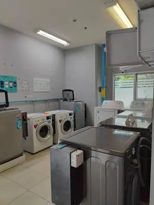 a hospital room with washing and drying machines at Aspire Rattanatibet 2 at MRT Purple Line in Nonthaburi