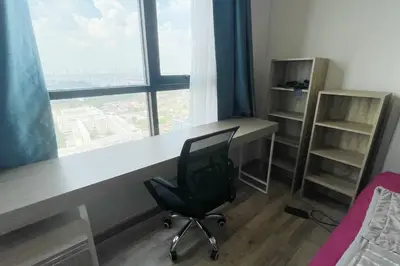 a desk with a chair in a room with a window at Niche Mono 2 Bedroom next to BTS Bearing in Samut Prakan