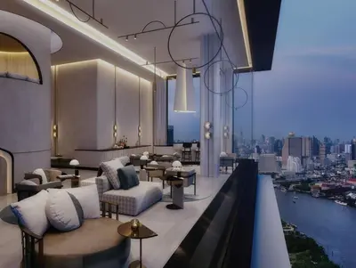 a hotel lobby with a view of the city at Luxurious River View chao phraya river in Bangkok