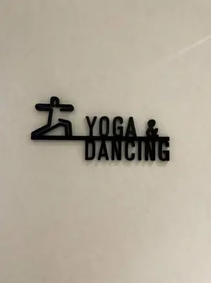 a sign that says yoga dancing on a wall at Luxurious River View chao phraya river in Bangkok