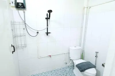a bathroom with a shower with a toilet in it at 3BR Entire Home - Close to Train, Boat, IconSiam, Asiatique in Bangkok