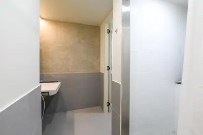 a bathroom with a sink and a shower at Hello my friend in Bang Bua Thong Railway Station