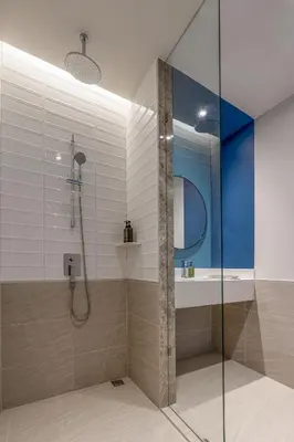 a bathroom with a shower and a sink at The Quarter Ramkhamhaeng by UHG in Bangkok