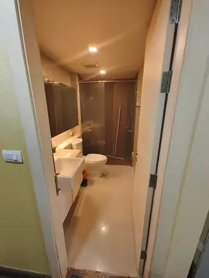 a bathroom with a toilet and a sink at بانكوك سوكمفيت شارع 5 liv at 5 in Bangkok