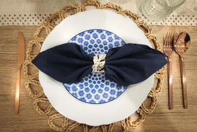a blue and white plate with a bow on a table at Asokes Hidden Gem Cozy Stay Next to the Park in Bangkok