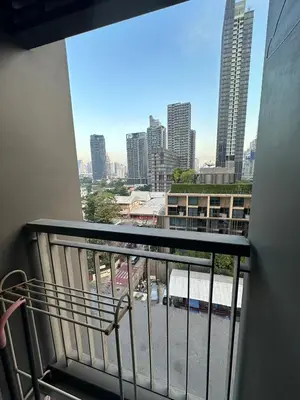 a balcony with a view of a city skyline at Thong Lor, Sukhumvit 36 in Bangkok