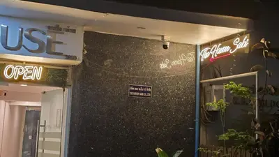 a building with a sign on the side of it at The Haven Sabi in Bangkok