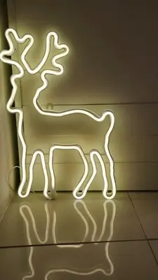 a neon sign of a llama on a wall at The Haven Sabi in Bangkok