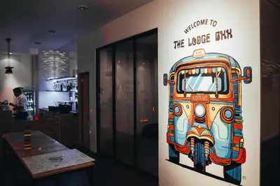 a wall with a painting of a bus on it at The LODGE BKK Hostel in Bangkok