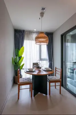 a dining room with a table and two chairs and a dining room at Luxurious Upscale Downtown Apartment in Bangkok