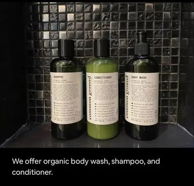 a group of three bottles of soap on a shelf at Luxurious Upscale Downtown Apartment in Bangkok