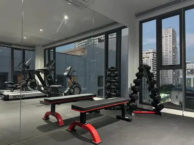 a gym with a bike and a bench in a room at 6th Avenue Sukhumvit BKK 308 BTS Asoke & Nana MRT Sukhumvit in Bang Kapi