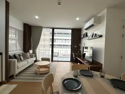 a living room with a couch and a table at 6th Avenue Sukhumvit 305 BTS Asoke & Nana MRT Sukhumvit in Bang Kapi