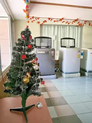 a christmas tree in the middle of a room at R Lodge in Bangkok