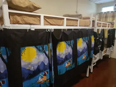 a group of bunk beds in a room at The House Hostel 2 in Bangkok