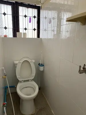 a bathroom with a white toilet in a room at The House Hostel 2 in Bangkok