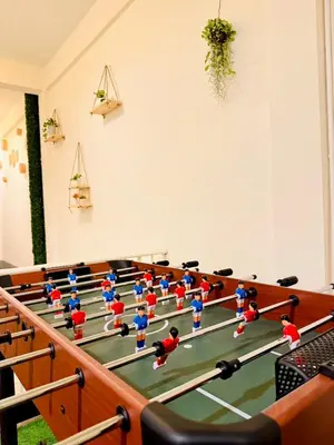 a group of toy people playing table tennis at Charming Hostel in Bangkok