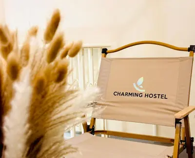 a chair with a chaminning hospital sign on it at Charming Hostel in Bangkok