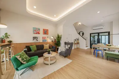 a living room with a couch and chairs and a table at Cozy Spacious 4BR Villa, 12pax, 200m BTS PhraKhanong, 10min ThongLo, Fast 500mbps Wifi in Bangkok