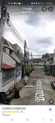 a view of a street with houses and buildings at Sirin Home in Bangkok