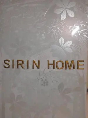 a book with the words stain home written on it at Sirin Home in Bangkok