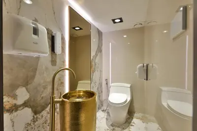 a bathroom with a toilet and a sink at Victora Hostel in Bangkok