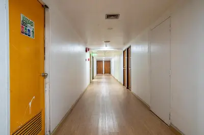 an empty hallway in an office building at PETRA Designer Apartment Sukhumvit, Nana BTS in Bangkok