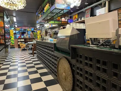 a restaurant with a cash counter in a store at Years 1981 in Bangkok