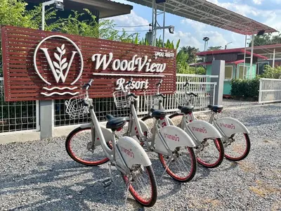 a group of bikes parked in front of a sign at Woodview Resort in Samut Prakan