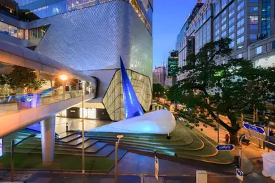 a view of a building with a whale sculpture at XX GO INN Silom - BTS Saint Louis สีลม in Bangkok