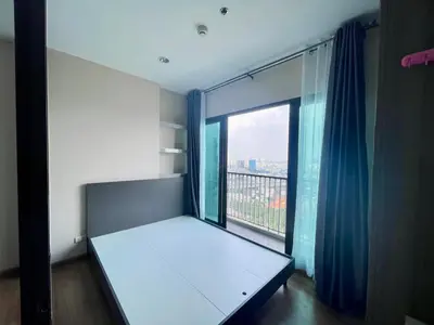 a room with a bed and a large window at the Tree Rio Bang-Aor in Bang O