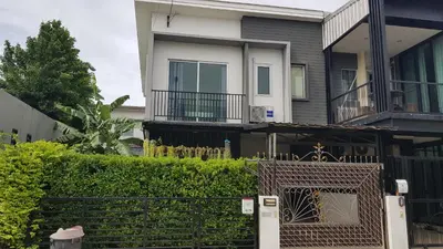 a house with a fence in front of it at Nido house in Ban Bang Phang