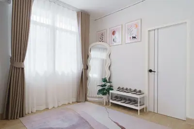a room with a white door and a window at Huai Khwang Cozy Home Comforts in Bangkok