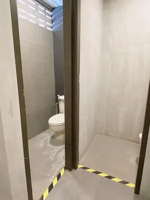 a bathroom with a toilet in a room at GO INN Silom BTS Surasak สถานีสุรศักดิ์ in Bangkok