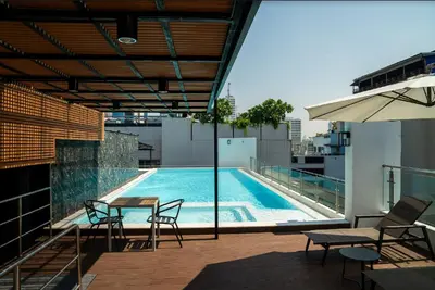 a swimming pool on the roof of a building at 6th Avenue Sukhumvit BKK 302 BTS Asoke & Nana MRT Sukhumvit in Bangkok