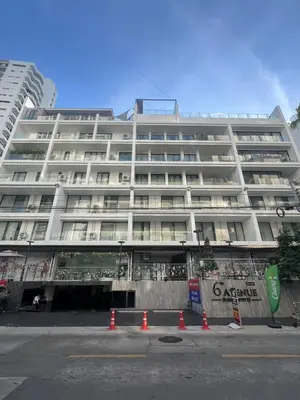 a large white building with orange cones in front of it at 6th Avenue Sukhumvit BKK 302 BTS Asoke & Nana MRT Sukhumvit in Bangkok