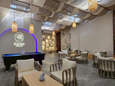 a restaurant with a pool table in a room with chairs at Inn De Sea - Hostel Bangkok Rambuttri Village Khaosan Area in Bangkok