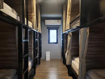 a room with a bunch of bunk beds at Fellows House in Bangkok