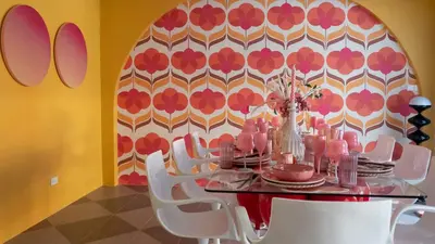 a dining room with a table and white chairs at Retrovibes Sathorn BTS ICONSIAM Asiatique Chao Phraya in Bangkok