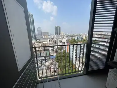 a balcony with a view of a city at \u5c0f\u592a\u9633\u6c11\u5bbf in Bangkok