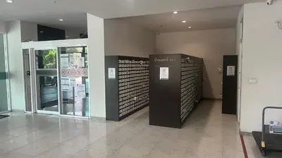 a lobby with two elevators in a building at GM bangson home in Bangkok