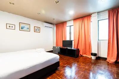 a hotel room with a bed and a television at xx Stay On Sukhumvit 11 BTS Nana in Bangkok