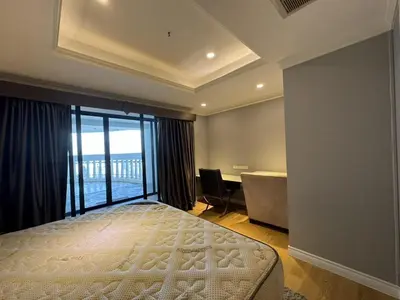 a bedroom with a bed and a desk and a window at NEW 1 bedroom 46FL Bangrak City view in Chinatown