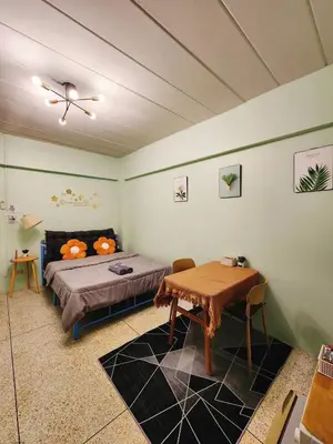 a bedroom with a bed and a table in it at 703-STP Homely room Free Wi-Fi and Near BTS line in Bangkok