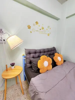 two teddy bears sitting on a couch in a room at 703-STP Homely room Free Wi-Fi and Near BTS line in Bangkok
