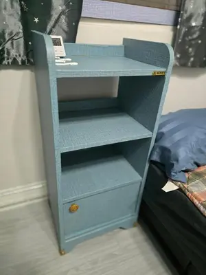 a blue dresser with a phone on top of it at 104 Peaceful and Cosy apartment near BTS with free WiFi in Bangkok