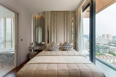 a bedroom with a large bed and a large window at Prime Area Super Cozy Luxury 2 bedroom Asoke BTS in Bangkok