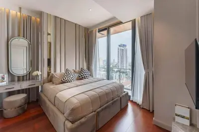 a bedroom with a large bed and a large window at Prime Area Super Cozy Luxury 2 bedroom Asoke BTS in Bangkok