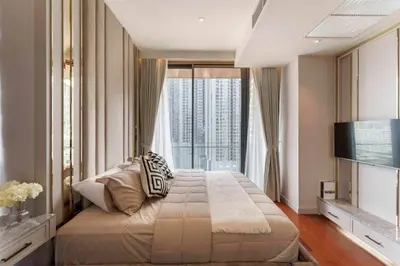 a bedroom with a large bed and a large window at Prime Area Super Cozy Luxury 2 bedroom Asoke BTS in Bangkok