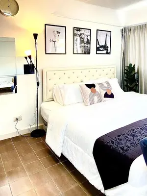 a bedroom with two beds with white sheets at Impact Arena Condo 2Rooms C3 by GoodRoom24 in Ban Bang Phang